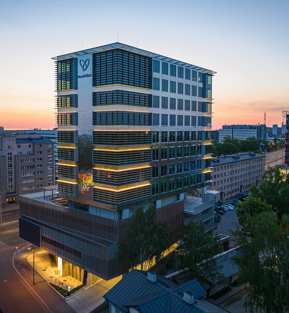 Office building with a glass and aluminium facade at sunset