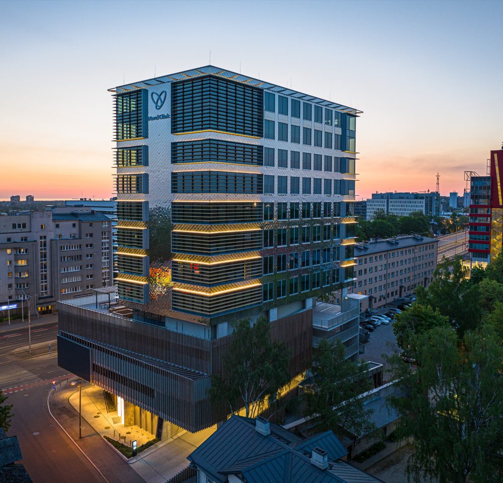 Office building with a glass and aluminium facade at sunset