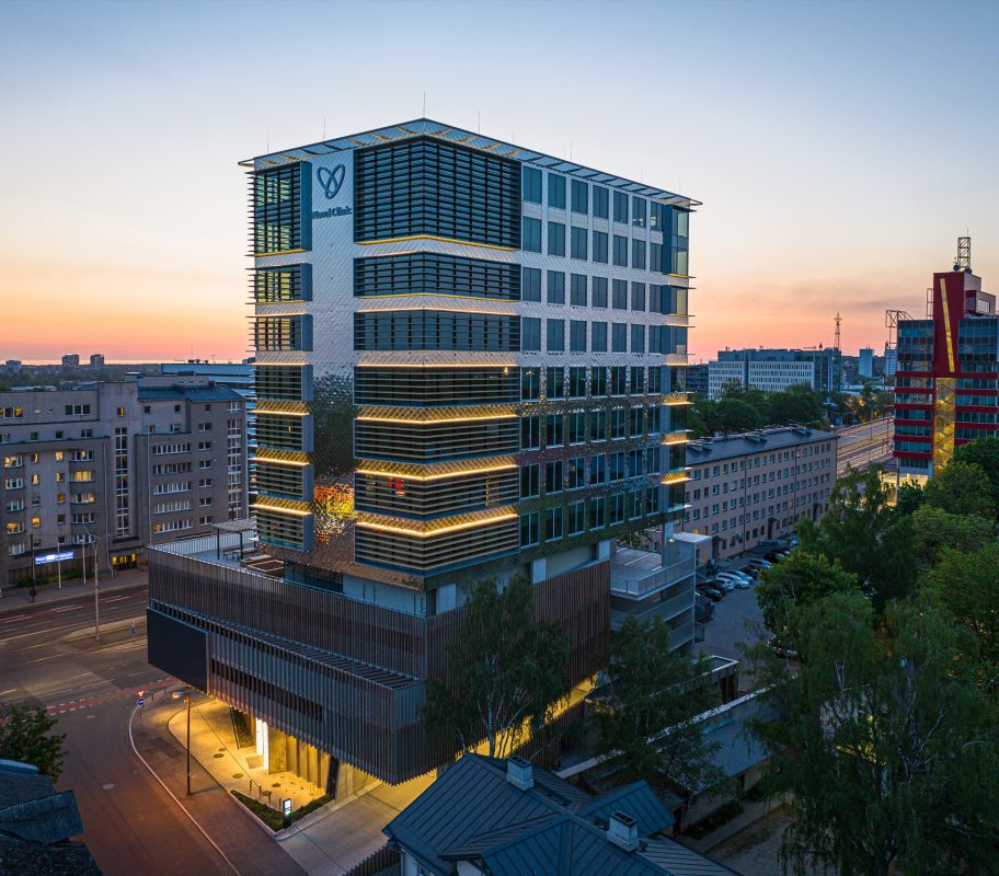 Office building with a glass and aluminium facade at sunset