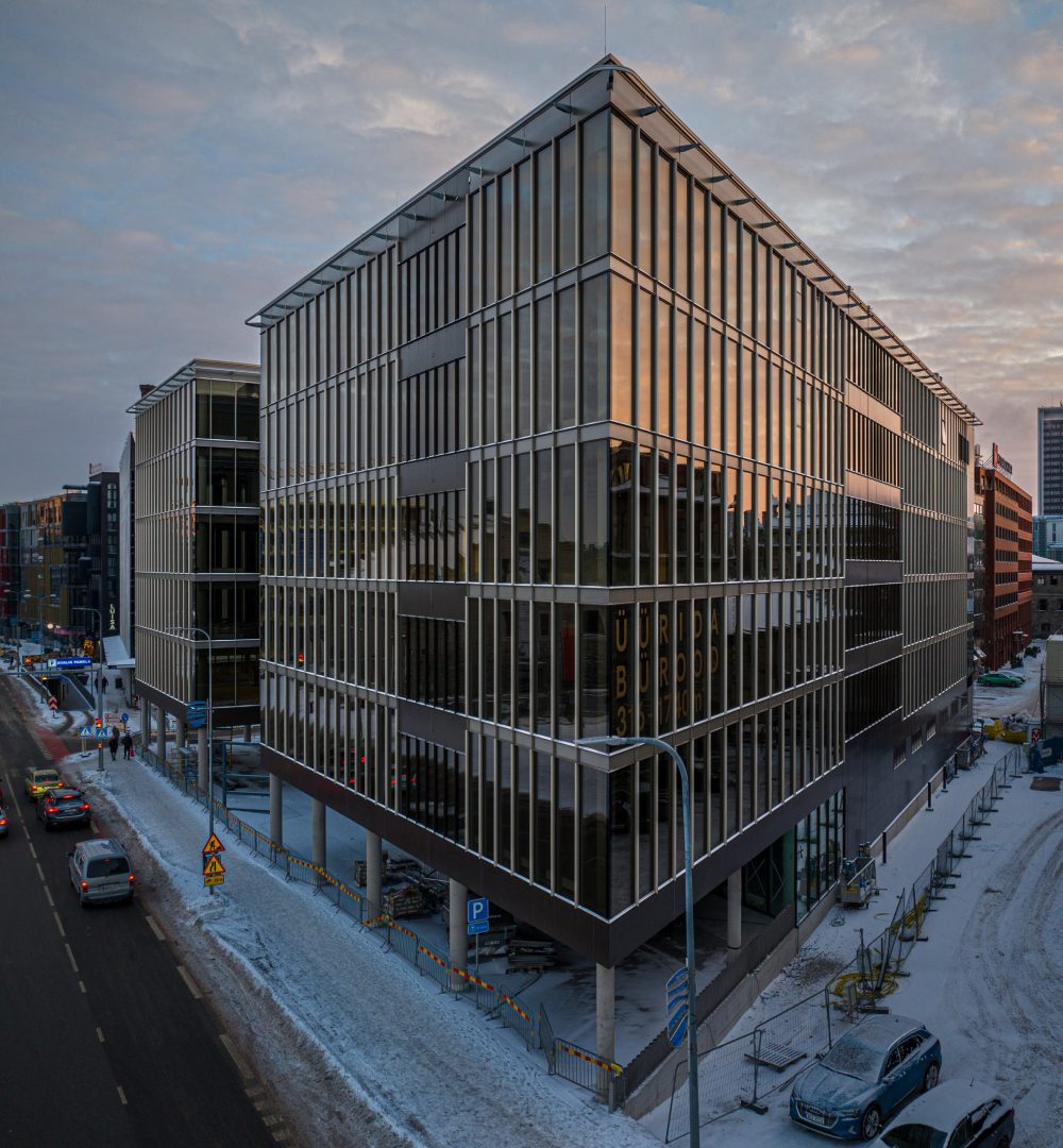 Glass office building on a winter street