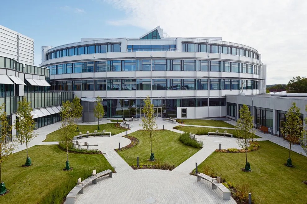 White office building with a landscaped courtyard